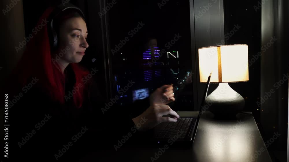 Woman working on laptop and chatting with client late at night finishes conversation and takes off headset feeling tired and exhausted. End of professional day of female freelancer doing job from home Woman working on laptop and chatting with client late at night finishes conversation and takes off headset feeling tired and exhausted. End of professional day of female freelancer doing job from home