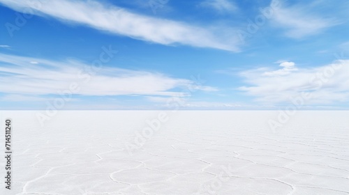 The peaceful expanse of a salt flat, the horizon stretching into the distance, unbroken and pure. photo