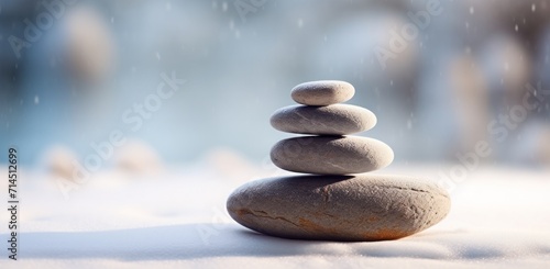 pebbles stacked on a snow covered field