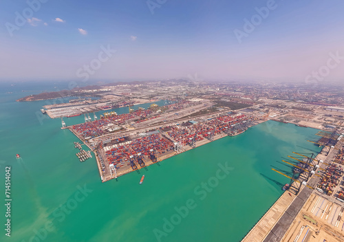 Industrial import-export port prepare to load containers. Aerial top view container ship in export and import global business and logistic. Global transportation and logistic business.