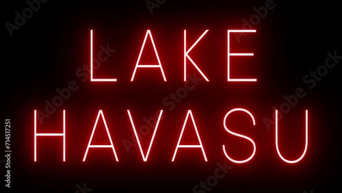 Flickering red retro style neon sign glowing against a black background for LAKE HAVASU photo