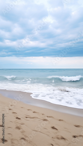 Sandy beach in nasty weather with big waves  stormy sea landscape with copyspace