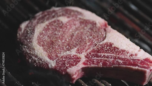 Grilled meat steak. Food and cuisine. Beef steak cooking over flaming grill. Grilled steaks. Grilled marbled beef steak on fire. Beef steaks on the grill with flames. Barbecue and grill. Roast beef.