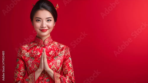 Lunar New Year Elegance: Chinese Woman in Qipao Celebrates Year of the Dragon, Cultural Affluence: Traditional Qipao Celebrations in the Year of the Dragon © Vincent