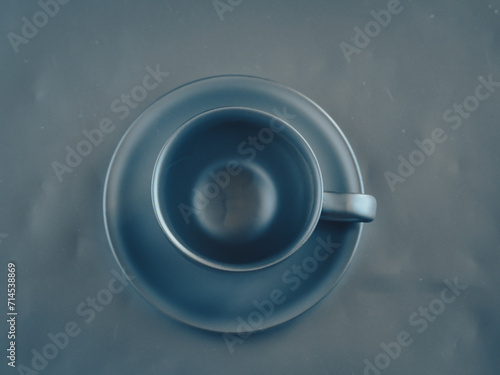 Silver coffee cup on silver table for home decoration.