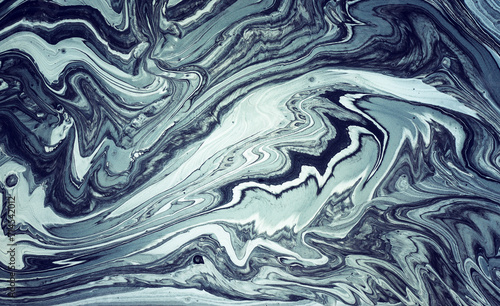 art photography of abstract marbleized effect background with black, dark blue and white creative colors. Beautiful paint.