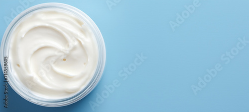 Jar of cream on light blue background, banner, generative AI photo