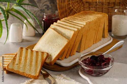 sliced toast bread toasted with cranberry jam