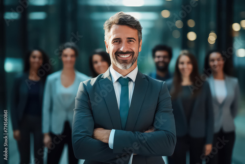 Portrait of a smiling group of different business people standing in a row in a bright modern office