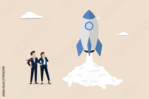 New project launch, creation and development, Business Startup concept, businessman and businesswoman launching a new rocket.