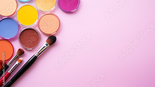 professional colorful makeup tools. makeup products on a pink background photo