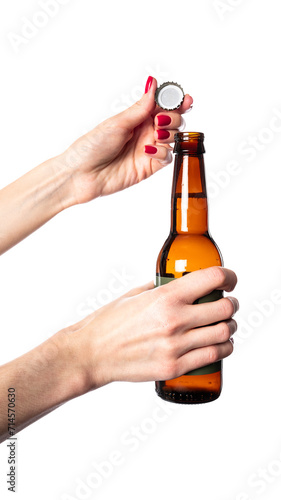 Hand holding a beer bottle isolated on white background. Beer bottle in hand isolated.