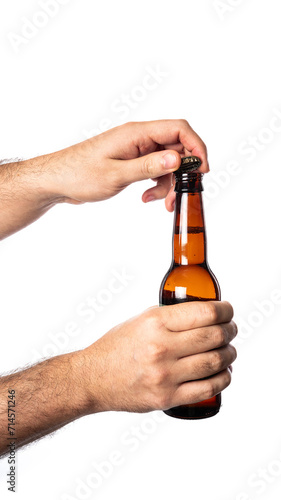 Hand holding a beer bottle isolated on white background. Beer bottle in hand isolated.