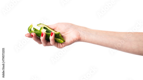 Green sweet bell pepper slices in hand isolated on a white background. Woman holding bulgarian pepper. Healthy food and ingredients concept