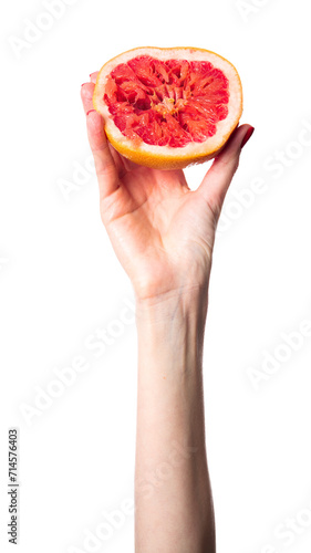 Juicy fresh grapefruit in a beautiful woman's hand isolated on white