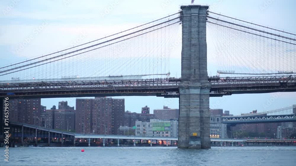 Cars and people move on Brooklyn bridge in New York. Cars and people move on Brooklyn bridge in New York.