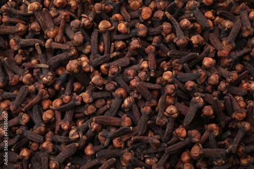 Many aromatic cloves as background, top view