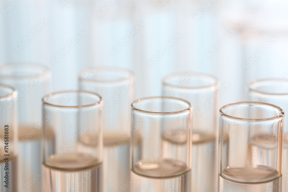 Laboratory analysis. Many glass test tubes on blurred background, closeup Laboratory analysis. Many glass test tubes on blurred background, closeup