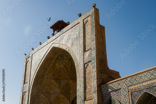 Detail of traditional Persian mosaic wall with floral ornament. West iwan of the courtyard of Jameh or Jame Mosque , Iran's oldest mosque in Isfahan, Iran. UNESCO World Heritage. photo