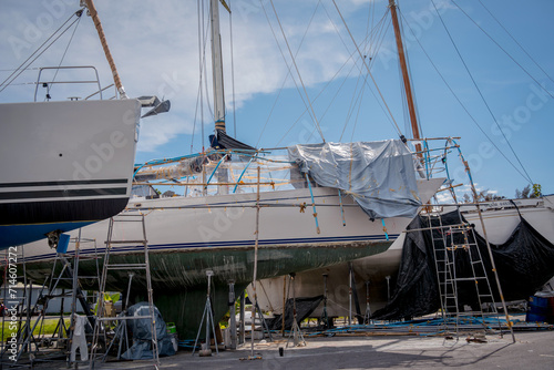 Motor yacht moored for repairs and service in dry dock
