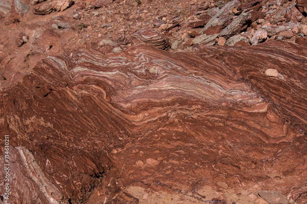 Fototapeta premium Red stones, blue sky, green water