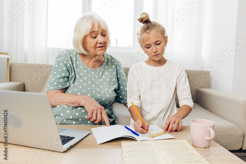 Child grandmother laptop family hugging
