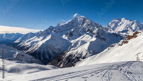 snowy greater caucasus ridge with the mt ushba at winter sunny day view from pastuchova kliffs at elbrus ski slope kabardino balkaria russia