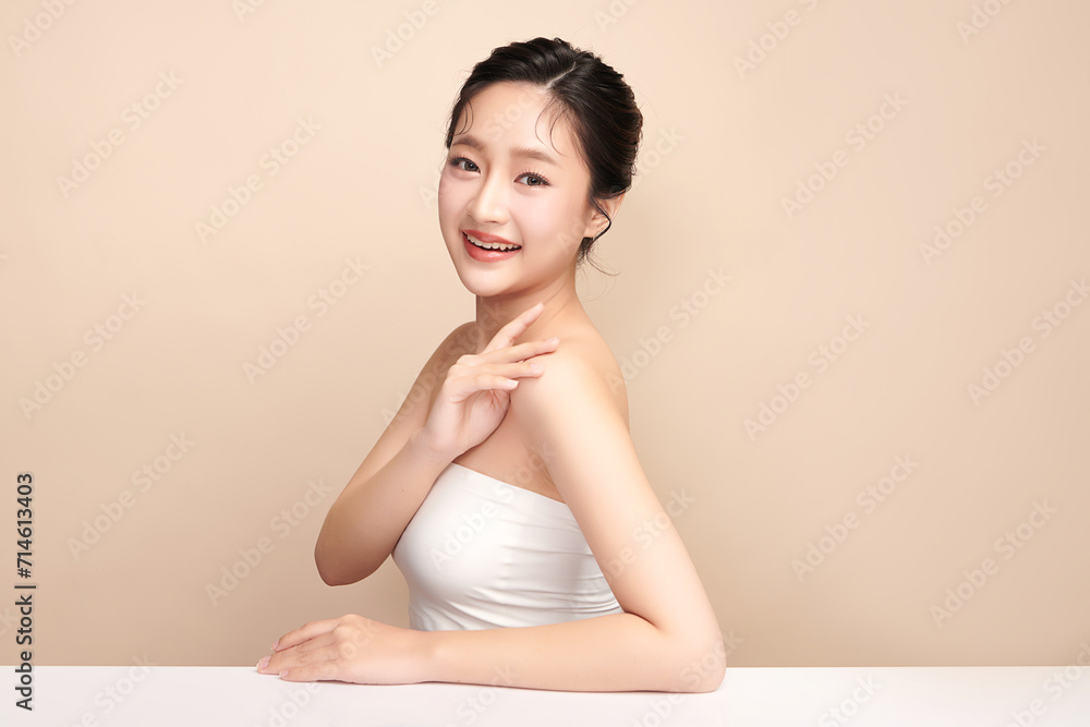 Beautiful young asian woman with clean fresh skin on beige background, Face care, Facial treatment, Cosmetology, beauty and spa, Asian women portrait. Beautiful young asian woman with clean fresh skin on beige background, Face care, Facial treatment, Cosmetology, beauty and spa, Asian women portrait.