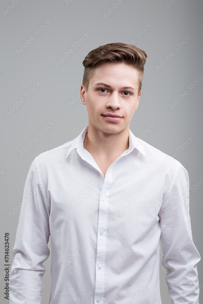 Direct gaze, white attire, silently communicative presence Direct gaze, white attire, silently communicative presence