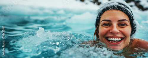 Joyful woman swimming in icy water. Cold water therapy concept.