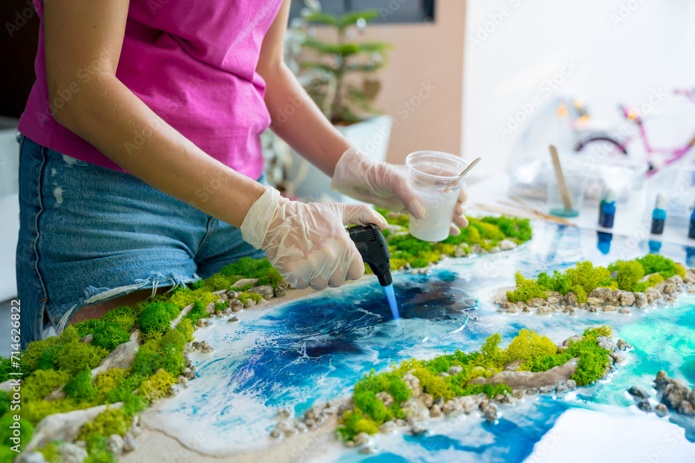 The process of making the art decor of epoxy resin, natural stones and moss The process of making the art decor of epoxy resin, natural stones and moss