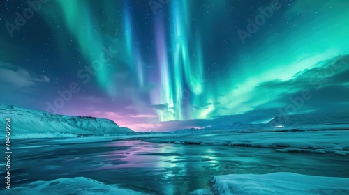  a green and purple aurora bore above a body of water with ice in the foreground and a mountain range in the background with snow on either side of the water.