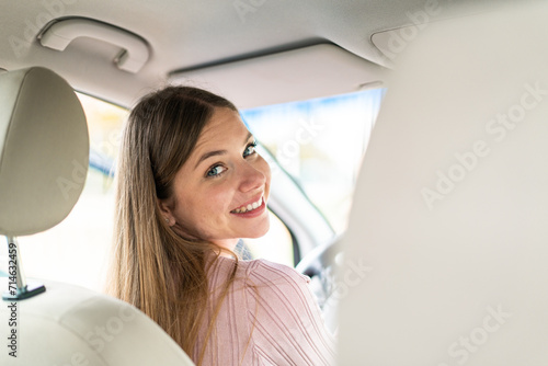 Young pretty blonde woman inside a car