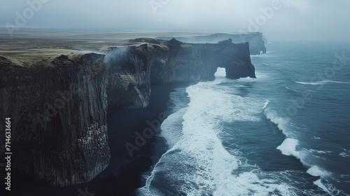  a large body of water next to a cliff with a large body of water in front of it and a large body of water on the other side of water.