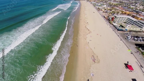 Wavy water of pacific ocean and Pacific Beach in San Diego  photo