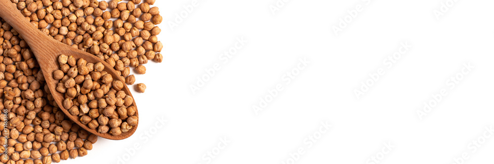 Dry organic chickpeas in a wooden spoon isolated on white background with copy space. Banner. Top view. Dry organic chickpeas in a wooden spoon isolated on white background with copy space. Banner. Top view.