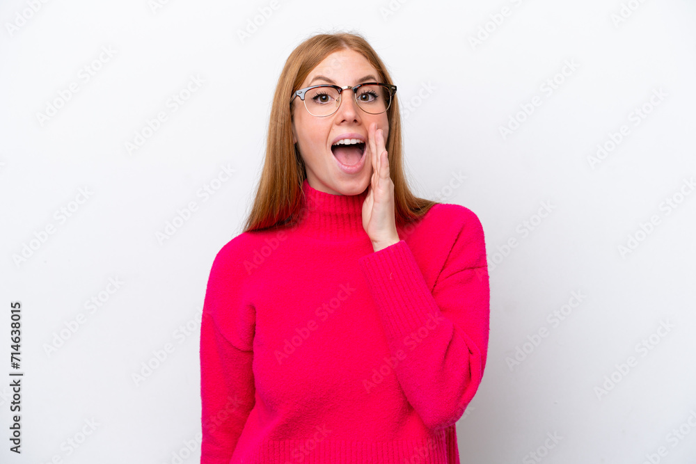 Young redhead woman isolated on white background with surprise and shocked facial expression Young redhead woman isolated on white background with surprise and shocked facial expression