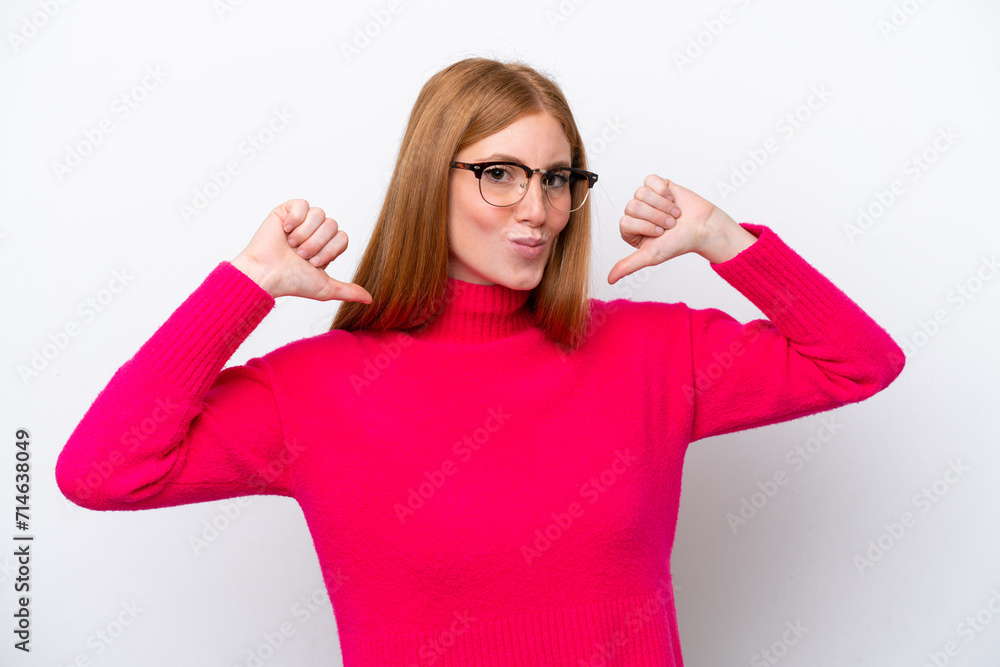 Young redhead woman isolated on white background proud and self-satisfied Young redhead woman isolated on white background proud and self-satisfied