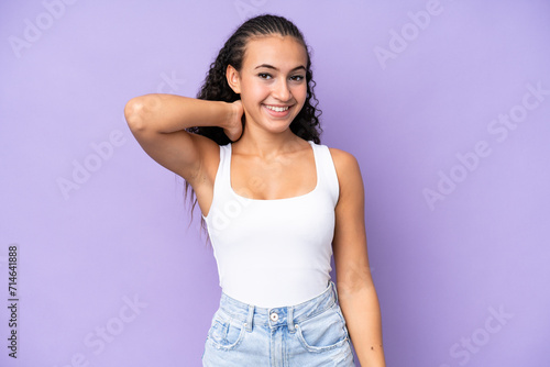 Young woman isolated on purple background laughing