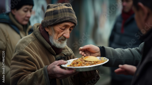 Warm meals for the homeless. A food distribution station for people in need. Such places include shelters  soup kitchens  and community kitchens.