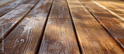 Restoring a wooden terrace floor includes removing dust after sanding.