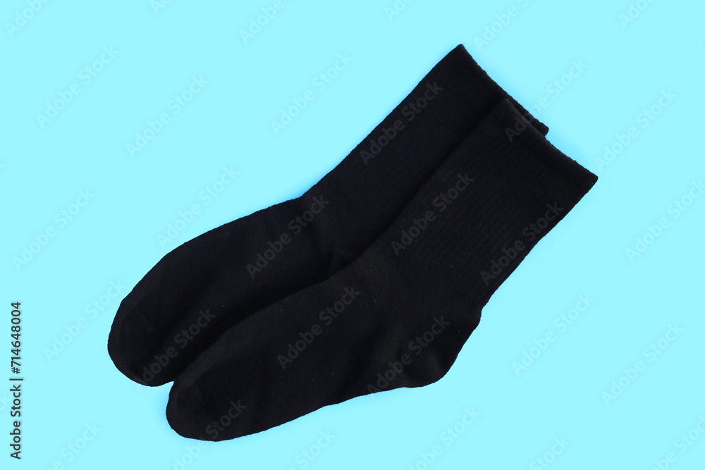 Black socks on blue background. Black socks on blue background.