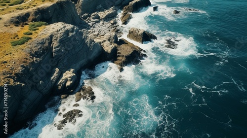 Aerial Perspective of Rugged Cliffs Meeting the Ocean