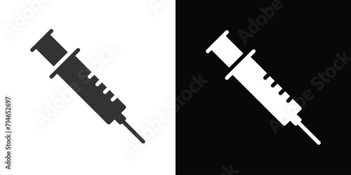 syringe on black and white  photo