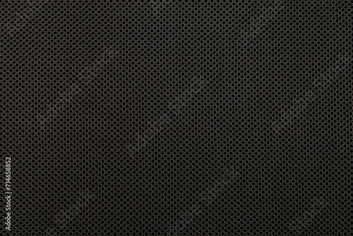 Black surface background. Textile texture knitted black threads. Speaker cover material.