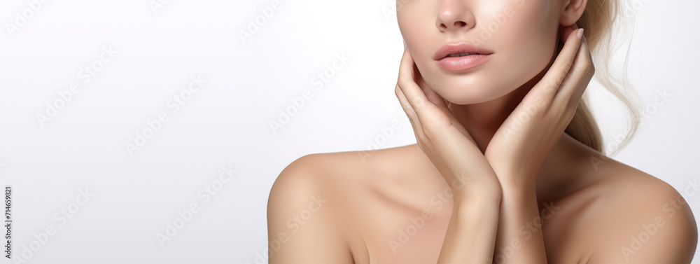 Beautiful Young Blond Woman with Perfect Skin touching her face. Facial treatment. Cosmetology, beauty and spa concept. Isolated on white background with copy space Beautiful Young Blond Woman with Perfect Skin touching her face. Facial treatment. Cosmetology, beauty and spa concept. Isolated on white background with copy space
