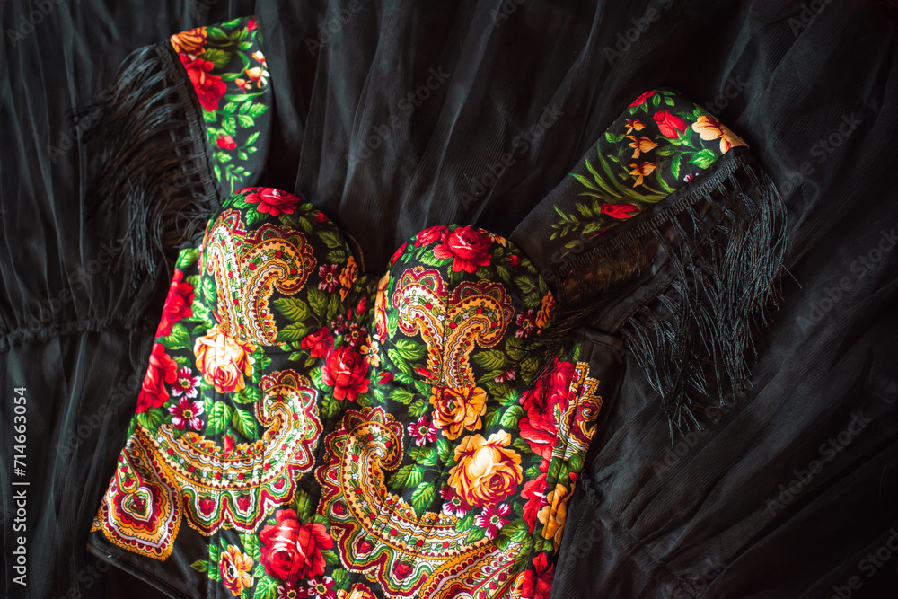 Ethnic embroidered corset, flowers details. Concept of beauty Slavic women, Boho style 