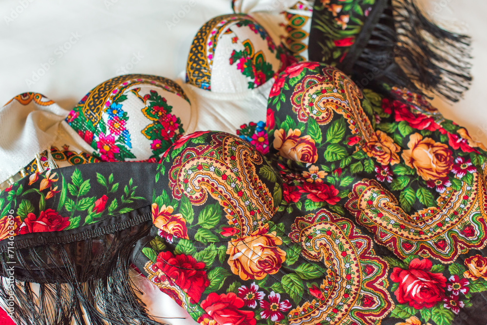 Fototapeta premium Ethnic embroidered corset, flowers details. Concept of beauty Slavic women, Boho style 