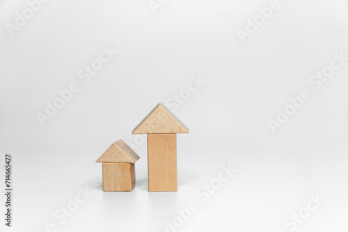 building wood blocks on white background; business or creative concept