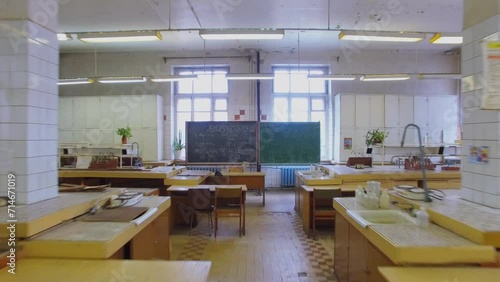 Laboratory with desks and chalkboard in University 